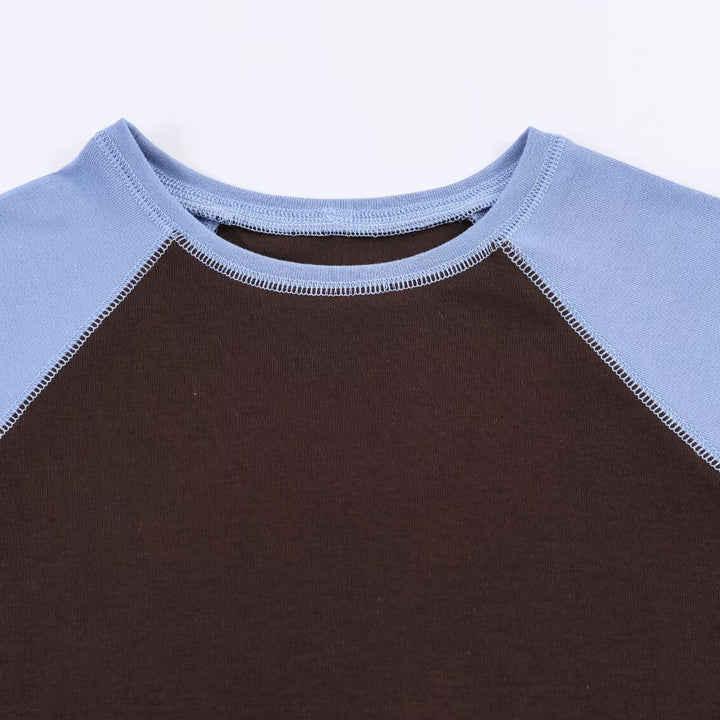 Damer sportigt T-shirt med kontrastärmar och avslappnad passform Mirla-Eva Jonsson