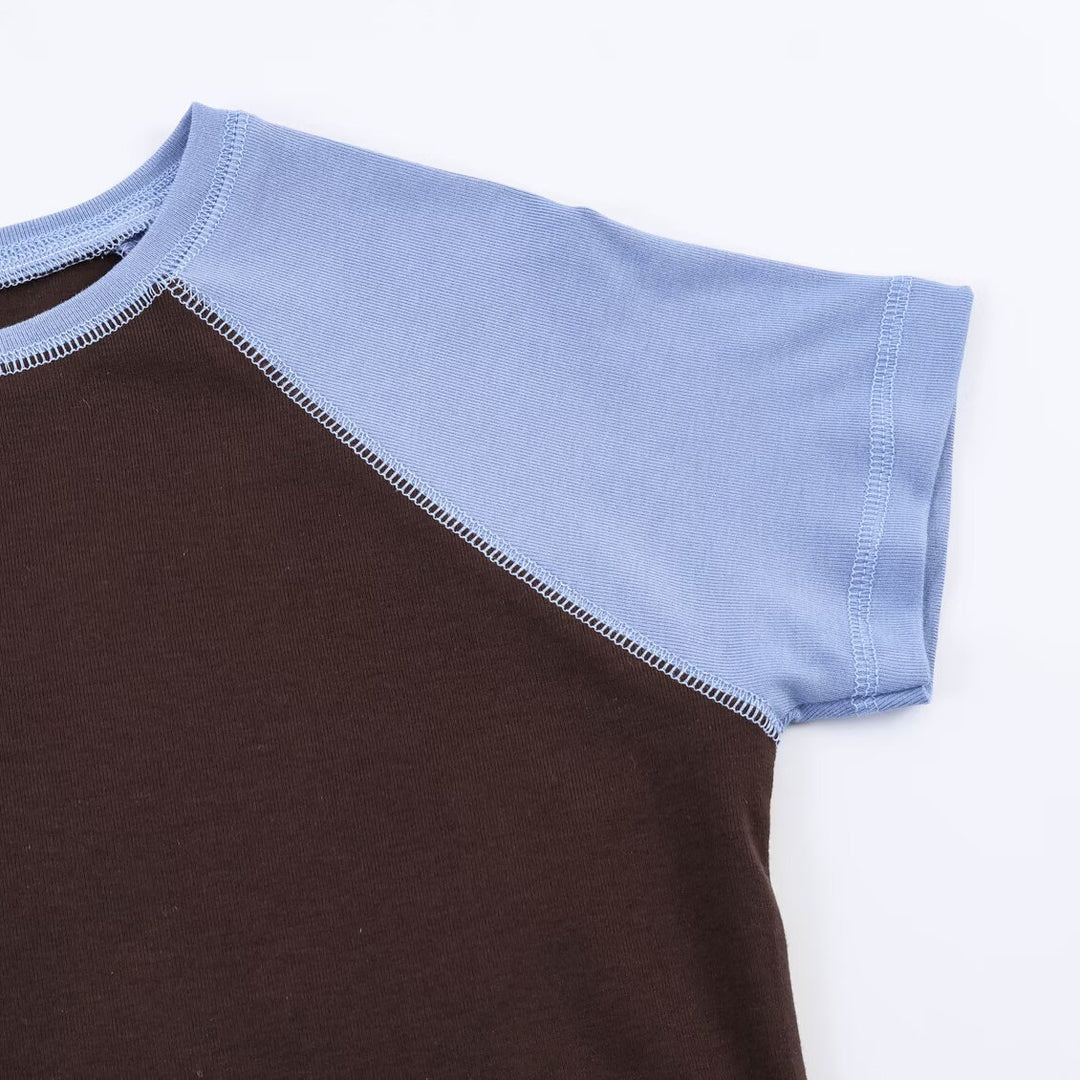 Damer sportigt T-shirt med kontrastärmar och avslappnad passform Mirla-Eva Jonsson