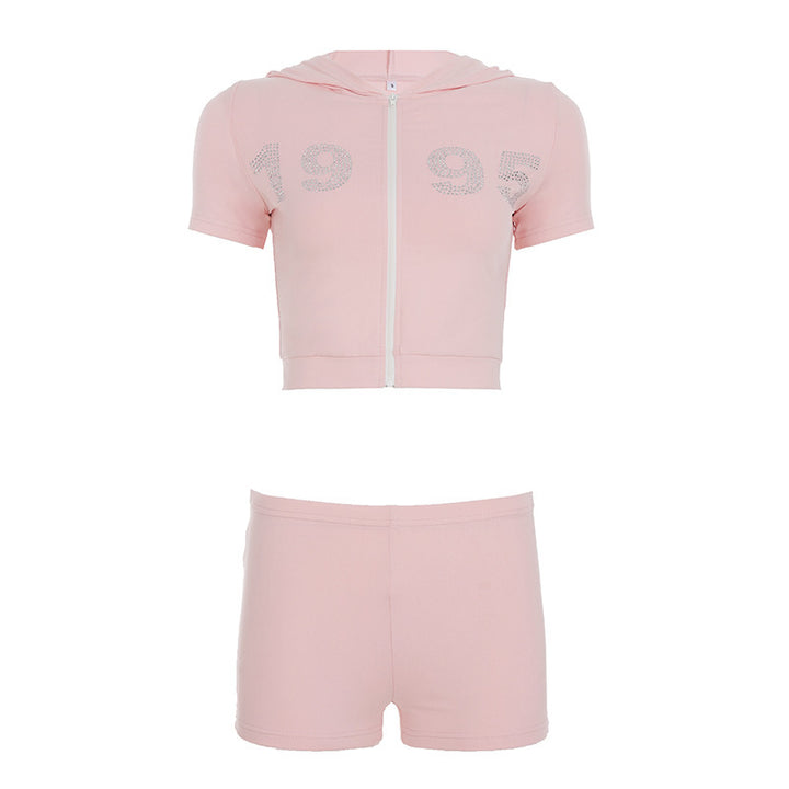 Damer sportigt cropped hoodie-set med korta shorts och glänsande accenter Mirla-Eva Jonsson