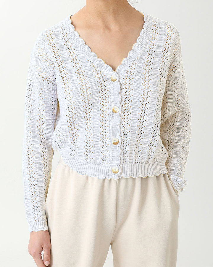 Damer stickad cardigan med feminin volang och knappdetaljer Mirla-Eva Jonsson