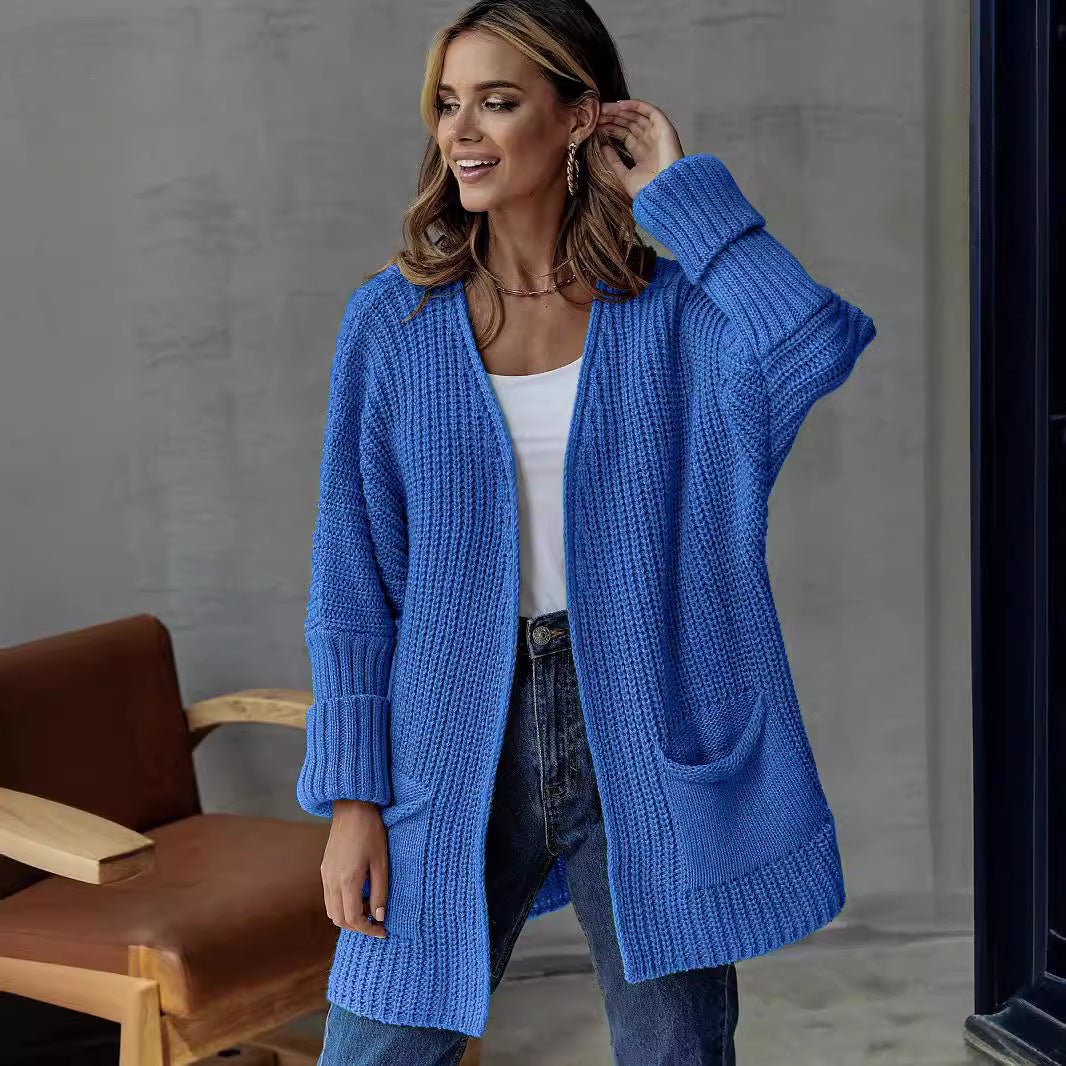 Damer stickad cardigan med generösa fickor och strukturerad design Mirla-Eva Jonsson