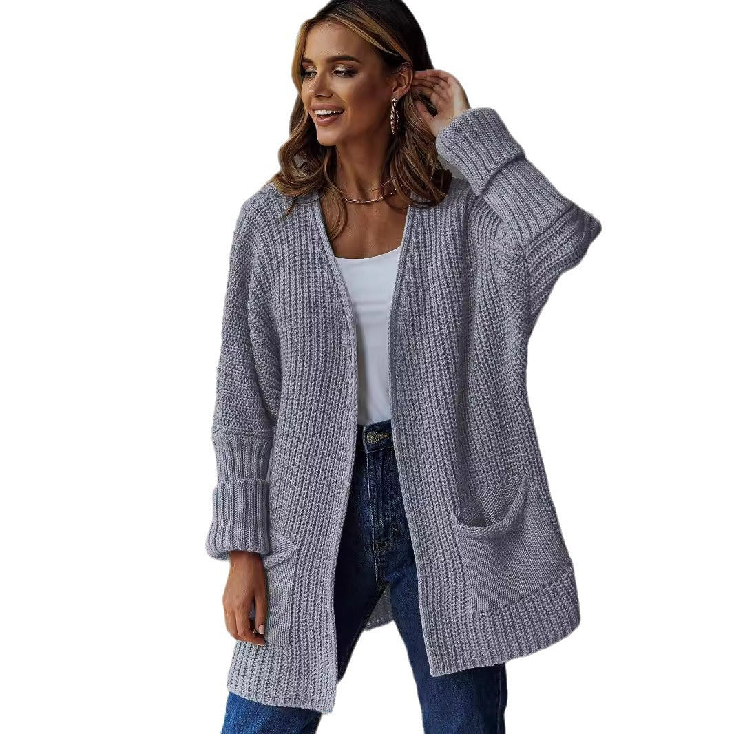 Damer stickad cardigan med generösa fickor och strukturerad design Mirla-Eva Jonsson