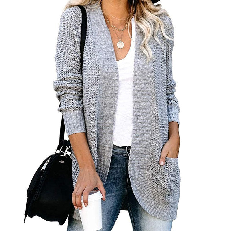 Damer stickad cardigan med öppen frontdesign och praktiska fickor Mirla-Eva Jonsson