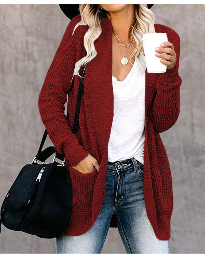 Damer stickad cardigan med öppen frontdesign och praktiska fickor Mirla-Eva Jonsson