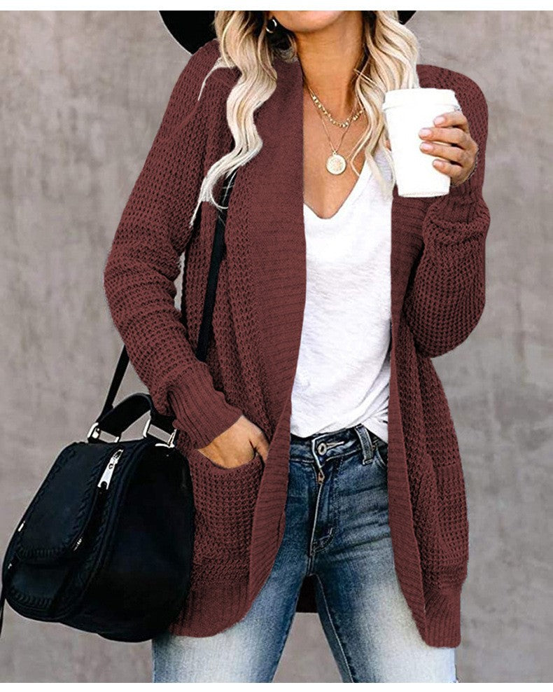 Damer stickad cardigan med öppen frontdesign och praktiska fickor Mirla-Eva Jonsson