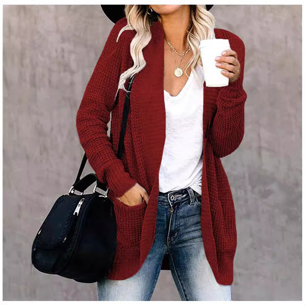 Damer stickad cardigan med öppen frontdesign och praktiska fickor Mirla-Eva Jonsson