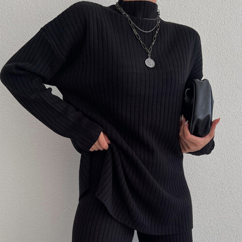 Damer stickad tröja i avslappnad oversized-stil med fin ribbstruktur och hög krage Mirla-Eva Jonsson