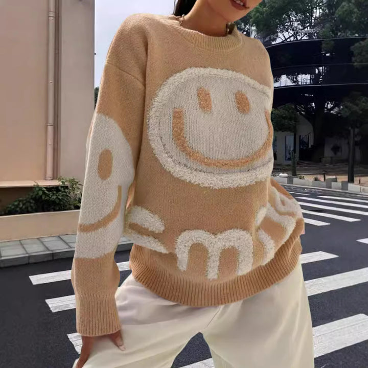 Damer stickad tröja med glatt emoji-motiv och bekväm passform Mirla-Eva Jonsson