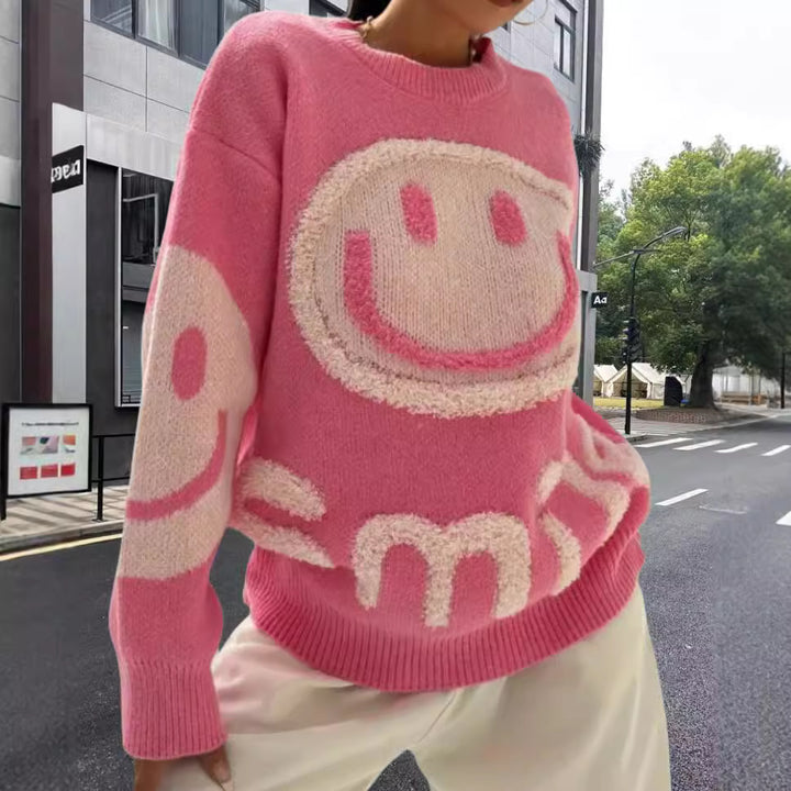 Damer stickad tröja med glatt emoji-motiv och bekväm passform Mirla-Eva Jonsson
