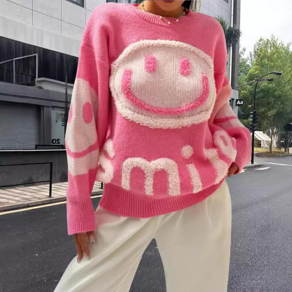 Damer stickad tröja med glatt emoji-motiv och bekväm passform Mirla-Eva Jonsson