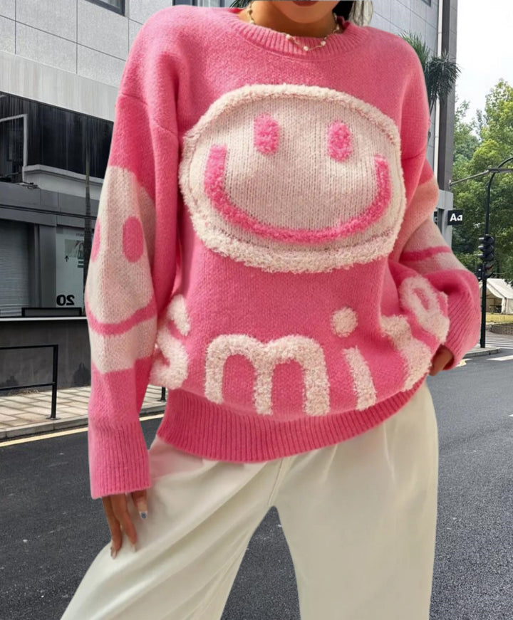 Damer stickad tröja med glatt emoji-motiv och bekväm passform Mirla-Eva Jonsson