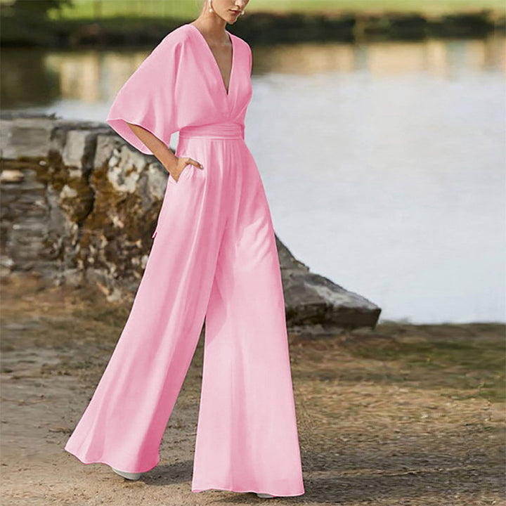 Damer stilfull jumpsuit med vida ben och elegant V-ringning Mirla-Eva Jonsson