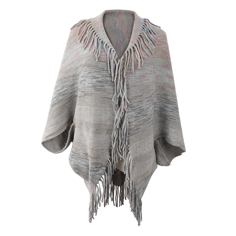 Damer stilren poncho med fransig fåll och strukturerad design Mirla-Eva Jonsson
