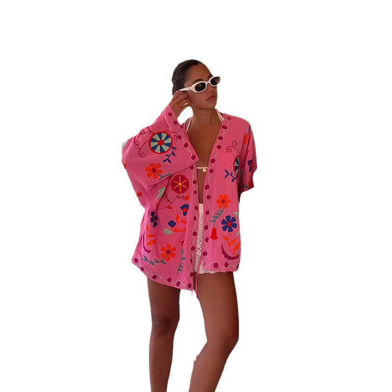 Damer strandkimono med färgglad blommönster och avslappnad passform Mirla-Eva Jonsson