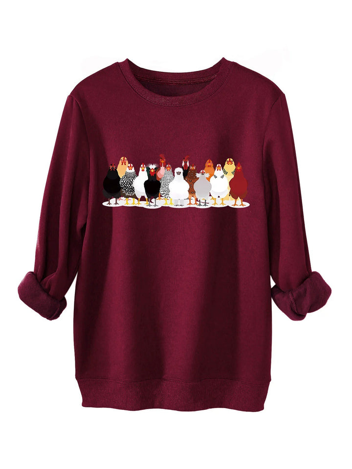 Damer sweatshirt med lekfullt hönsmotiv Mirla-Eva Jonsson