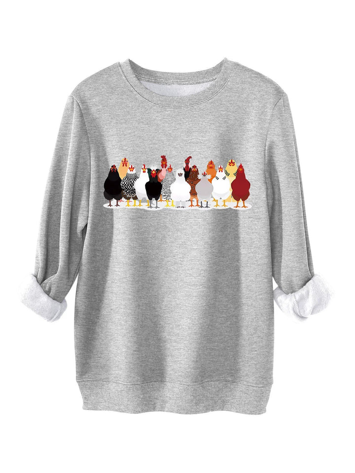 Damer sweatshirt med lekfullt hönsmotiv Mirla-Eva Jonsson