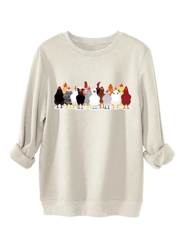 Damer sweatshirt med lekfullt hönsmotiv Mirla-Eva Jonsson