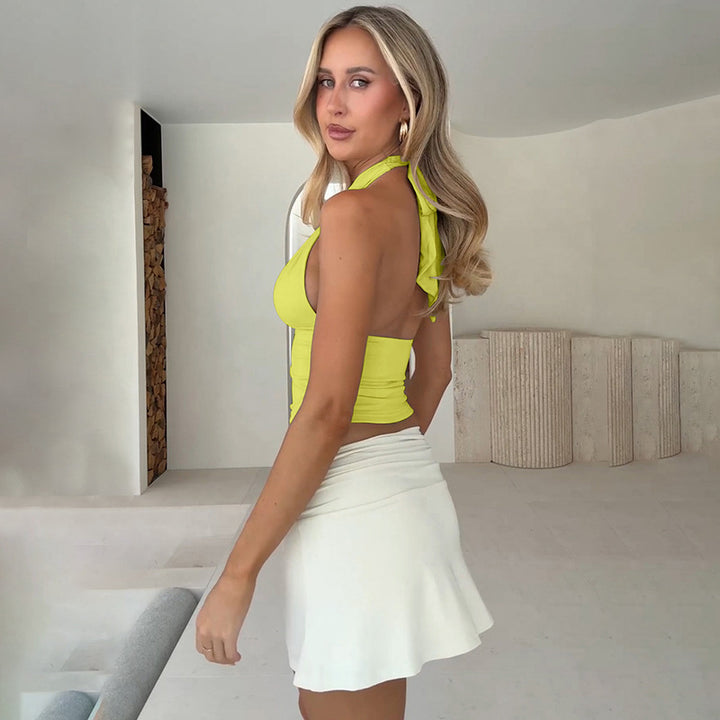 Damer topp med raffinerad halterneck-design och elegant spänne Mirla-Eva Jonsson