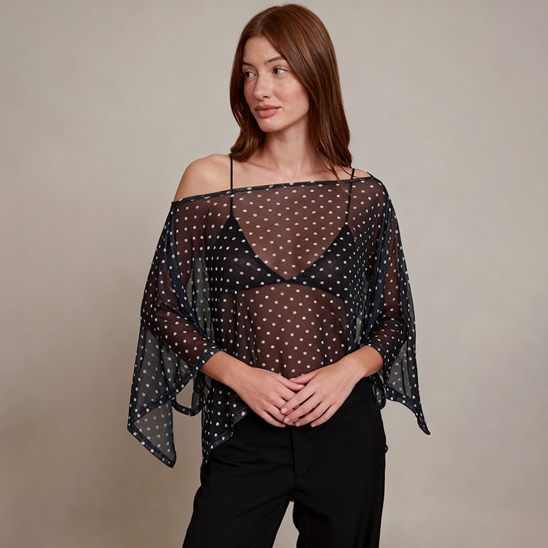Damer transparent överdel med asymmetrisk skärning och polka prickar Mirla-Eva Jonsson