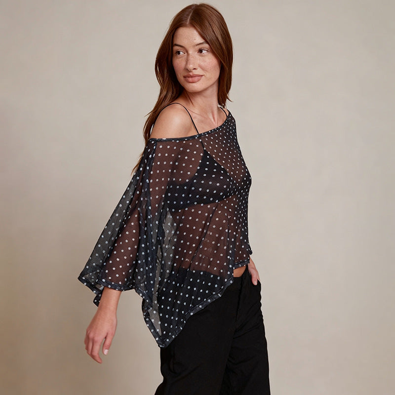 Damer transparent överdel med asymmetrisk skärning och polka prickar Mirla-Eva Jonsson