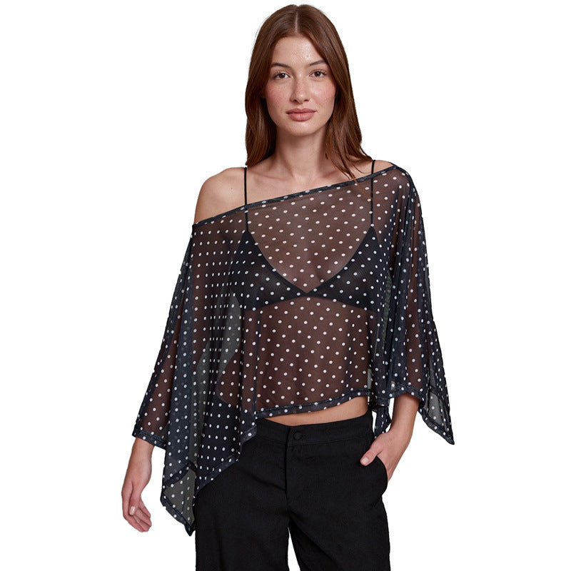 Damer transparent överdel med asymmetrisk skärning och polka prickar Mirla-Eva Jonsson