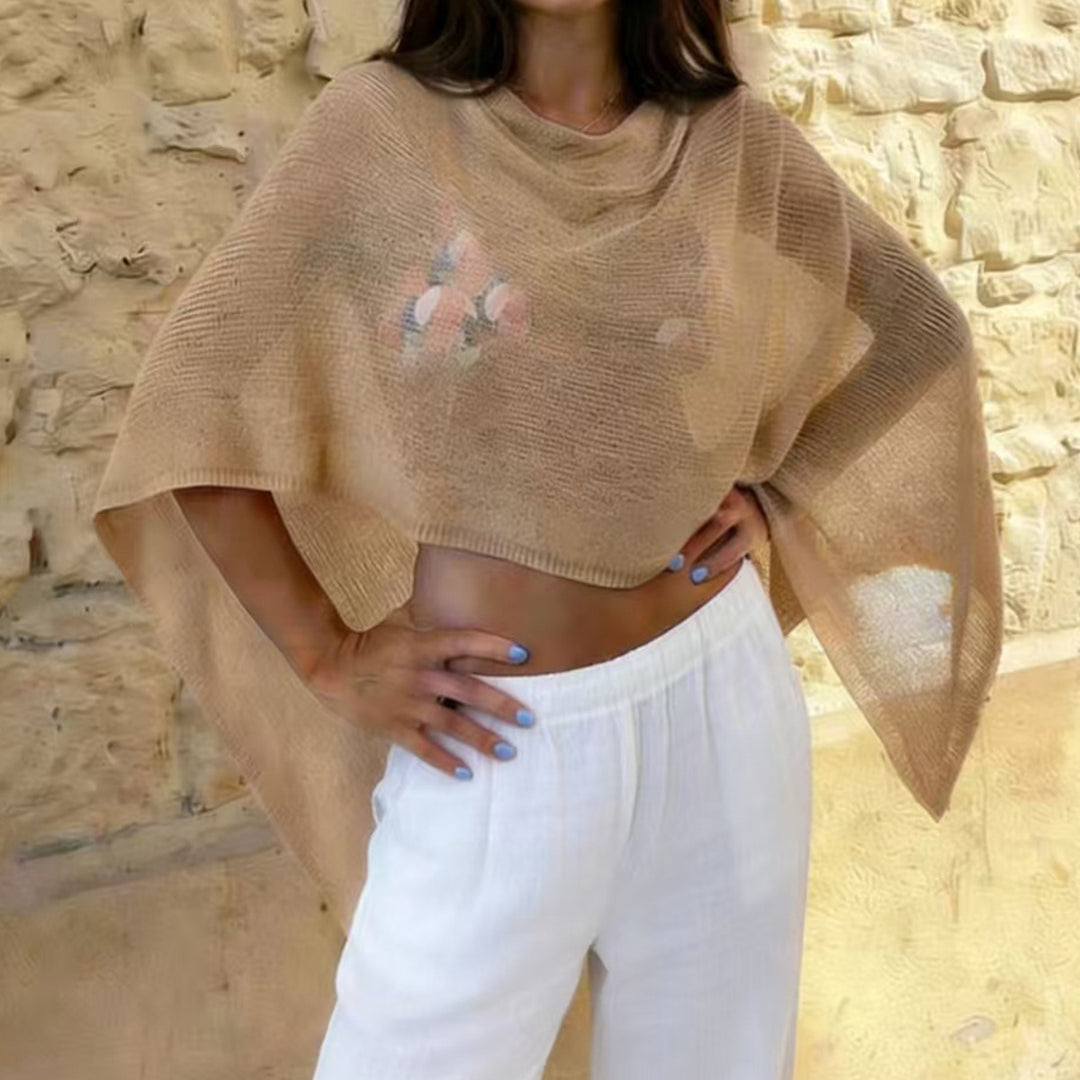 Damer transparent strandkappa med asymmetrisk skärning och elegant design Mirla-Eva Jonsson