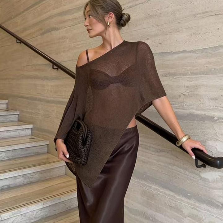 Damer transparent strandkappa med asymmetrisk skärning och elegant design Mirla-Eva Jonsson