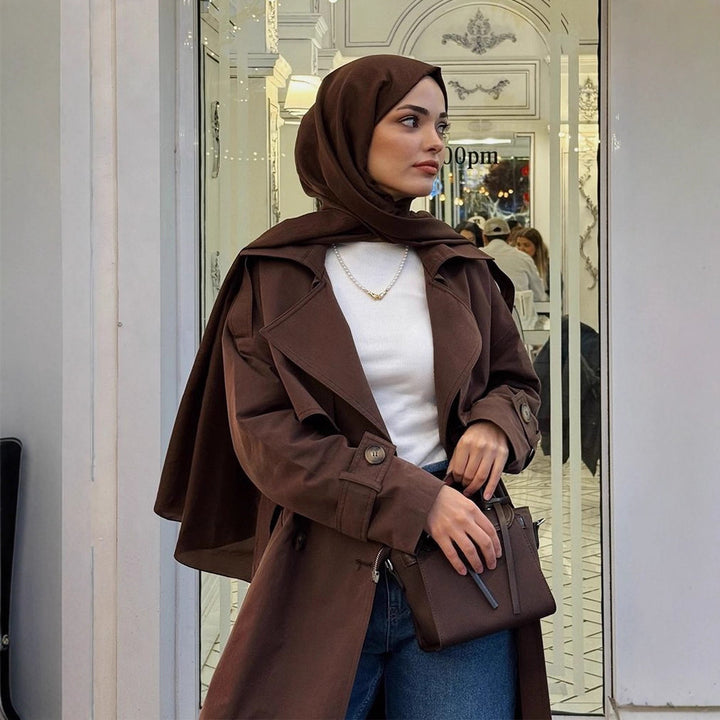 Damer trendig trenchcoat med bälte och voluminösa ärmar Mirla-Eva Jonsson