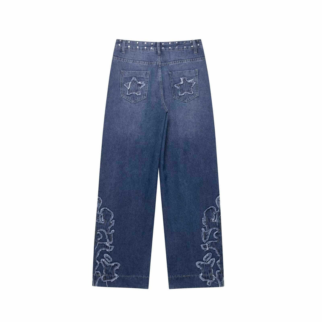Damer utsvängda jeans med blommönstrade broderier och dekorativa knapppdetaljer Mirla-Eva Jonsson