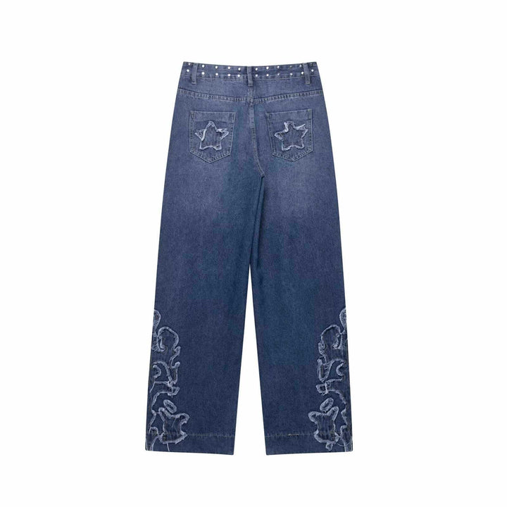 Damer utsvängda jeans med blommönstrade broderier och dekorativa knapppdetaljer Mirla-Eva Jonsson