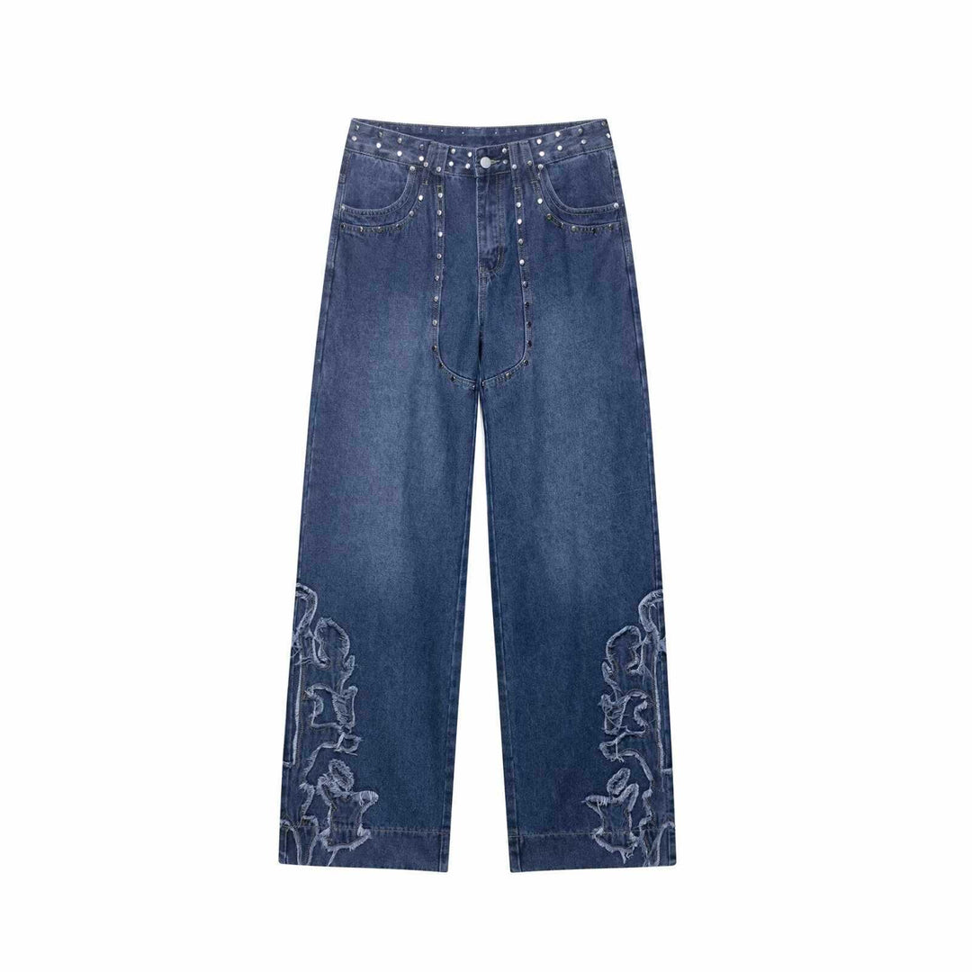 Damer utsvängda jeans med blommönstrade broderier och dekorativa knapppdetaljer Mirla-Eva Jonsson