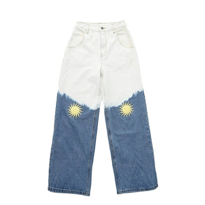 Damer vida denimbyxor med kreativa solbroderier Mirla-Eva Jonsson