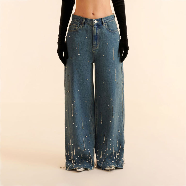 Damer vida jeans med dekorativa pärl-applikationer Mirla-Eva Jonsson