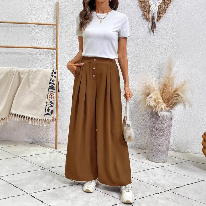 Damer vidgad plisserad byxa med hög midja och eleganta knapprar Mirla-Eva Jonsson