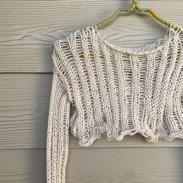 Damer virkade crop-top med öppna ärmar och avslappnad design Mirla-Eva Jonsson