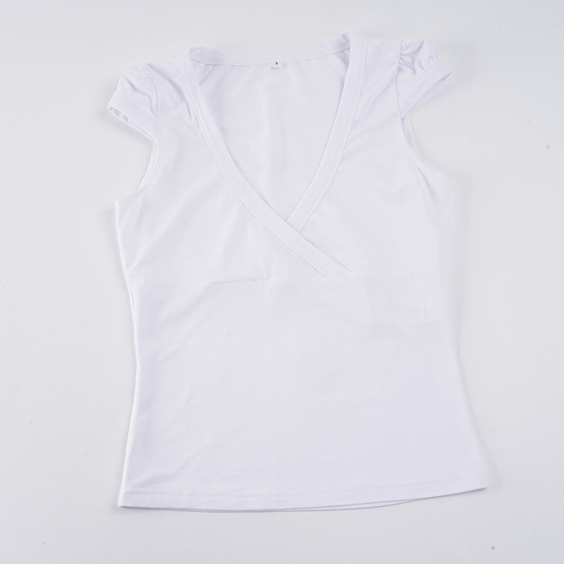 Damer wrap-top med djup V-hals och elastiska puffärmar Mirla-Eva Jonsson