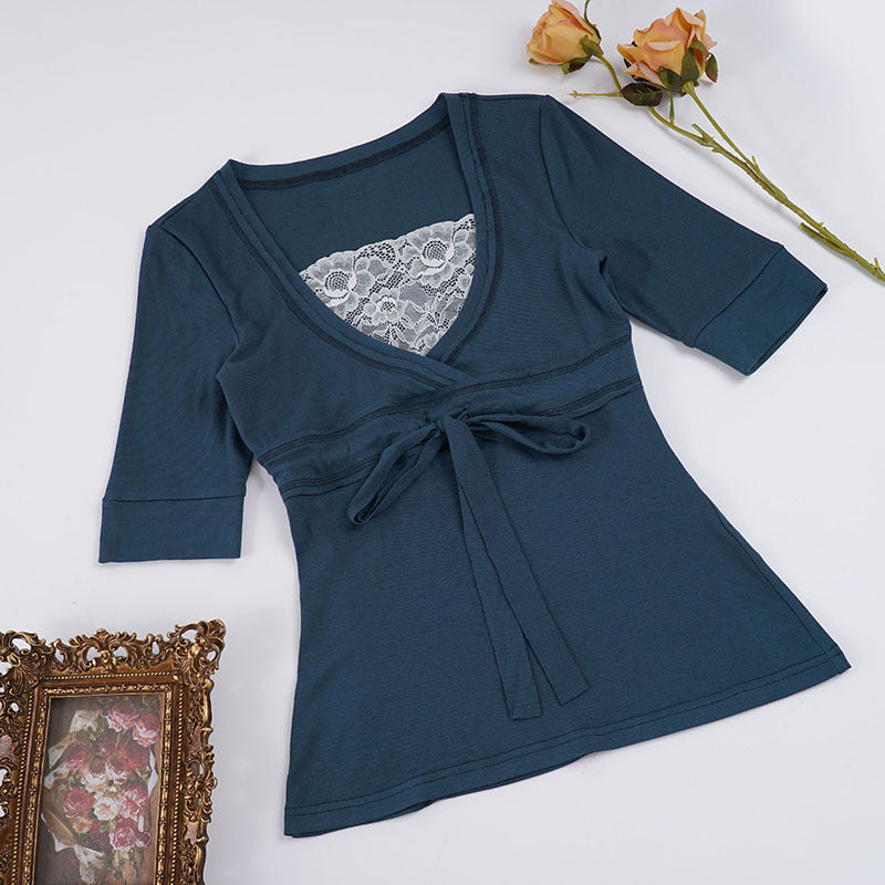 Damer wrap-top med raffinerad frontknut och eleganta ärmavslutningar Mirla-Eva Jonsson