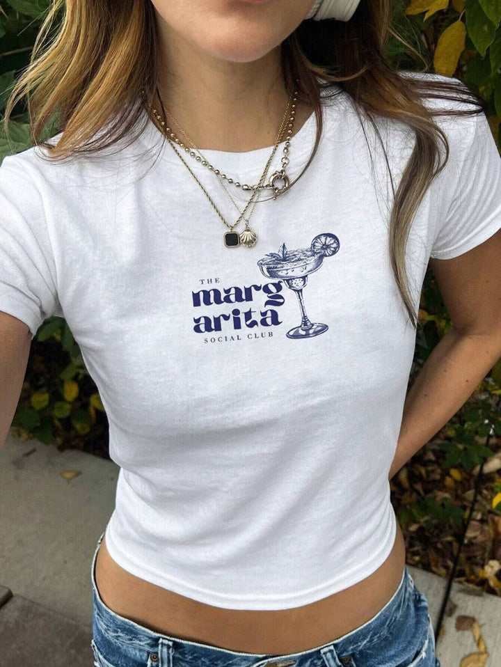 Damern Crop-T-Shirt med kreativt skelettdesign och inspirerande text Mirla-Eva Jonsson