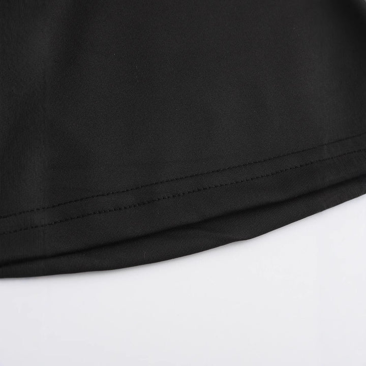Damern Crop-T-shirt med iögonfallande text och figurnära design Mirla-Eva Jonsson