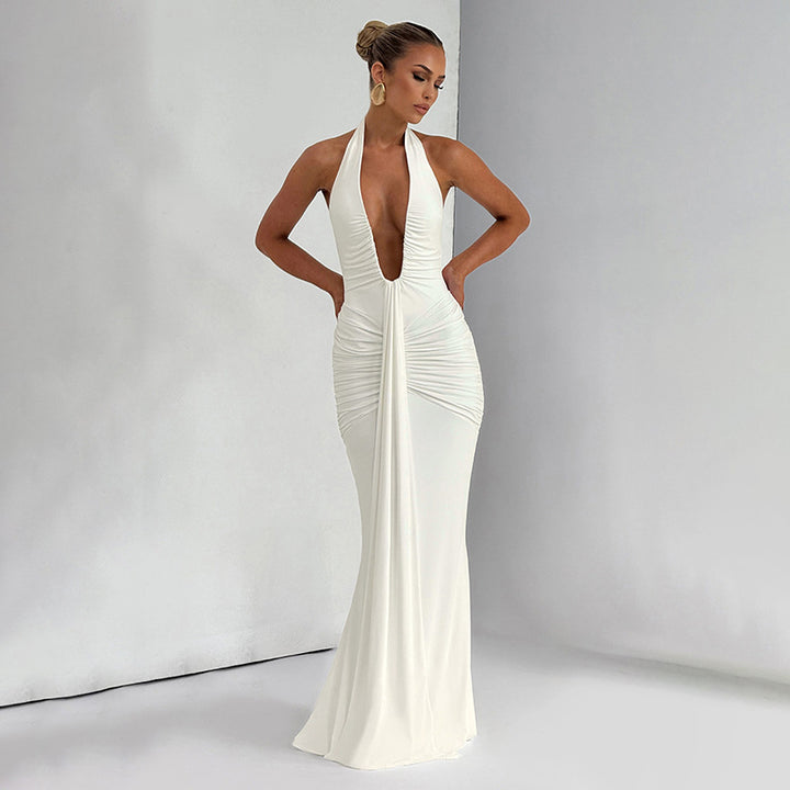 Damern Elegant Maxi-klänning med djup V-ringning och volangdetaljer Mirla-Eva Jonsson