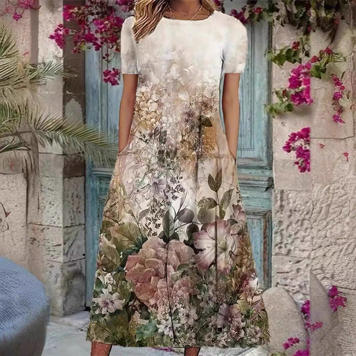 Damern Elegant Maxiklänning med blommönster och ömt rundhalsutskärning Mirla-Eva Jonsson