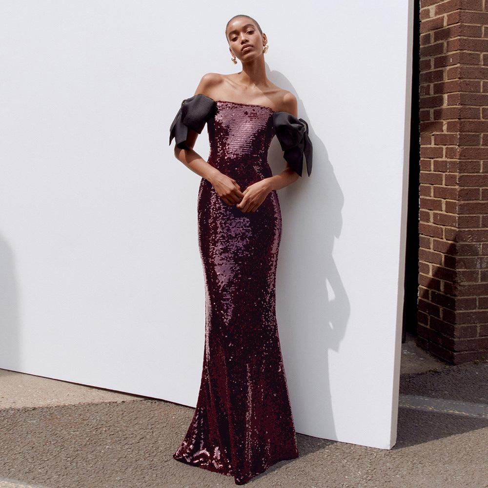 Damern Elegant Paljett Maxi Klänning med off-shoulder Design och dekorativa Slips Mirla-Eva Jonsson