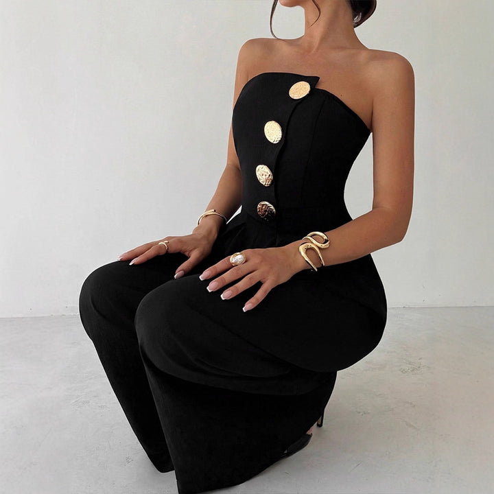 Damern Elegant jumpsuit med asymmetrisk utskärning och dekorativa knappar Mirla-Eva Jonsson
