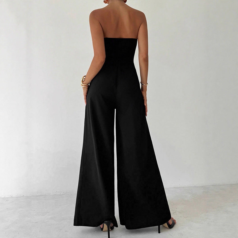 Damern Elegant jumpsuit med asymmetrisk utskärning och dekorativa knappar Mirla-Eva Jonsson
