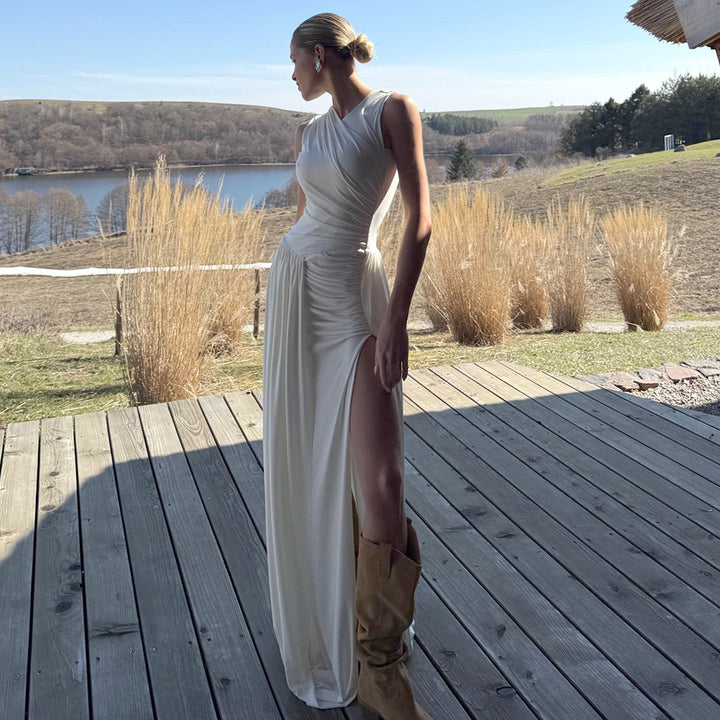 Damern Elegant lång klänning med draperad kjol och sidoklyfta Mirla-Eva Jonsson
