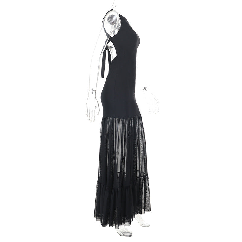 Damern Elegant maxiklänning med transparenta insatser och volangdetaljer Mirla-Eva Jonsson
