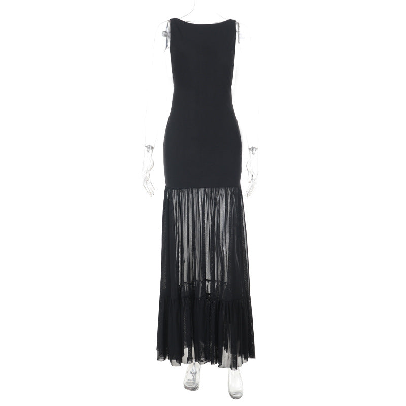 Damern Elegant maxiklänning med transparenta insatser och volangdetaljer Mirla-Eva Jonsson