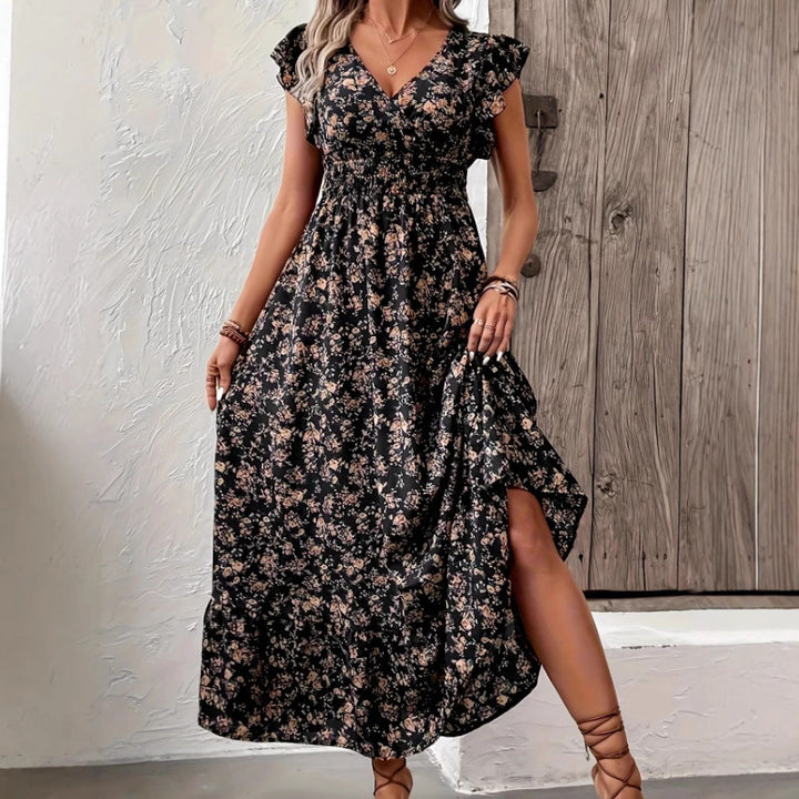 Damern Maxi-klänning med blommigt mönster och voluminösa ärmar Mirla-Eva Jonsson