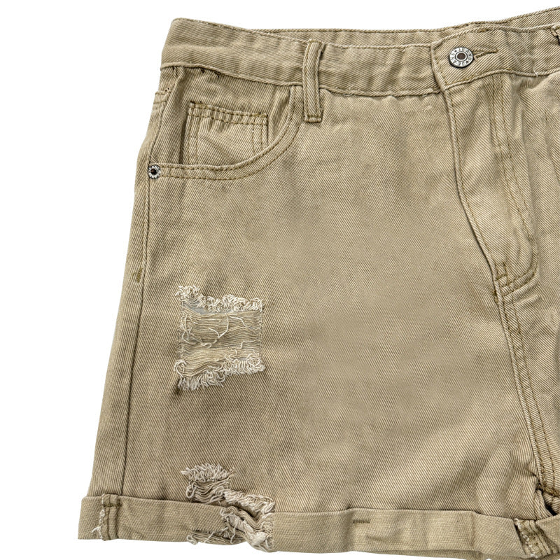 Damern Modiska Destroyed Shorts i Denim med avslappnad passform och fransiga detaljer Mirla-Eva Jonsson