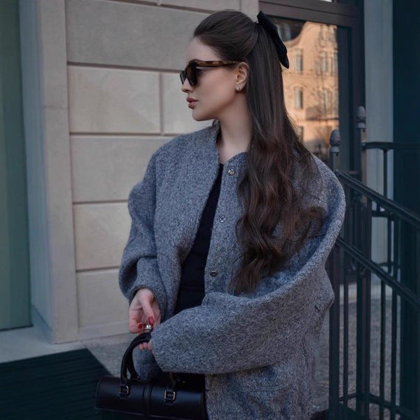 Damern Oversized Stickad jacka i mjukt teddytyg med ståkrage och sidofickor Mirla-Eva Jonsson